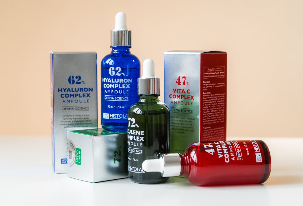 gallery-4 Close-up of ampoules and packaging for skincare products, emphasizing vibrant design.