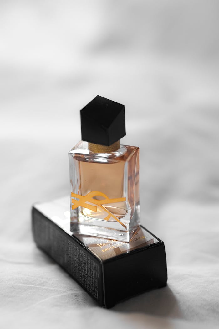 services-03 Elegant perfume bottle with black cap on a stylish box in Paris.